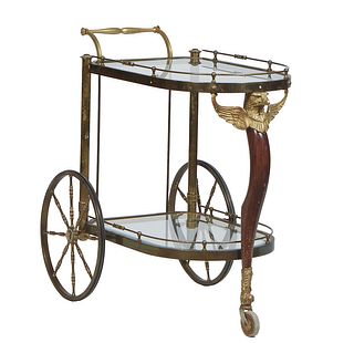Empire Style Brass and Glass Rolling Bar Cart, 20th c. the arched glass top with a brass rail, on a front mahogany leg, topped with an eagle surmount,
