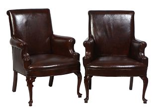 Pair of Carved Mahogany Brown Faux Leather Queen Anne Style Armchairs, 20th c., the canted rolled back over rolled arms to a bowed seat, on cabriole l