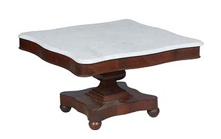 American Classical Caved Mahogany Marble Top Center Table,19th c., the square ogee edge rounded corner figured white marble above a conforming skirt, 
