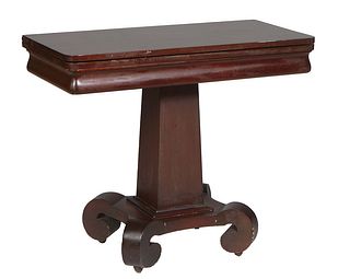 American Classical Carved Mahogany Games Table, 19th c., the rounded corner top on a lyre form trestle base with four scrolled legs, H.- 30 1/4 in., W