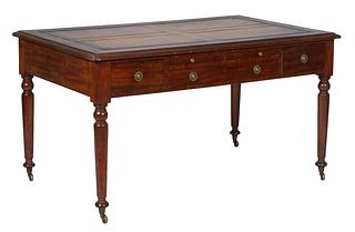 English Carved Mahogany Partner's Writing Table, early 20th c., the stepped rounded edge top with an inset gilt tooled tan leather writing surface, ov