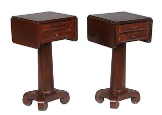 Pair of American Classical Carved Mahogany Drop Leaf Work Tables, 19th c., the rectangular top over a bank of two central drawers flanked by rounded c