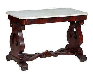 American Classical Carved Mahogany Marble Top Side Table, 19th c., the rounded edge rectangular figured white marble over a wide skirt, on pierced lyr