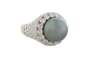 Lady's 18K White Gold Dinner Ring, with a 12mm very dark grey cultured Tahitian pearl atop a pierced diamond mounted border, over diamond mounted shou