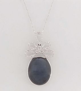 14K White Gold Pendant, with an oval 40.93 carat blue sapphire with a diamond mounted butterfly bale, and a diamond pear shaped loop, on a 14K white g