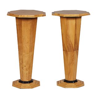 Pair of Art Deco Style Carved Blonde Walnut Lamp Tables, 20th/21st c., the stepped octagonal top on a tapered octagonal plinth with an ebonized socle,