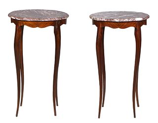 Pair of Carved Beech Marble Top Lamp Tables, 21st c., the beveled edge brown marble shaped circular tops, over a shaped skirt, on four graceful tall c