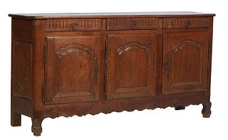 French Provincial Louis XV Style Carved Oak Sideboard 19th c., the stepped cookie corner ogee edge top over three reeded frieze drawers, above three a