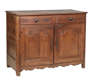 French Provincial Carved Oak Louis XIV Style Carved Oak Sideboard, 19th c., the stepped sloping edge three board rounded corner top over three frieze 