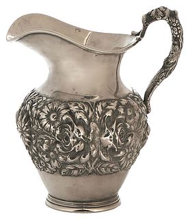 Stieff Sterling Repousse Hand Chased Pitcher, #310, with high relief floral decoration, H.- 8 5/8 in., W.- 5 5/8 in., D.- 7 5/8 in. Wt.- 21.46 Troy Oz