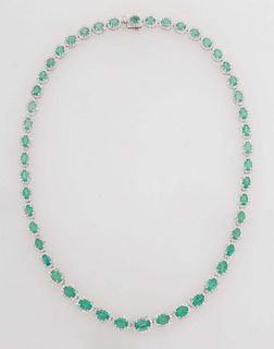14K Yellow Gold Link Necklace, each of the 48 oval links with a graduated oval emerald atop a border of tiny round diamonds, total emerald wt.- 22.93 
