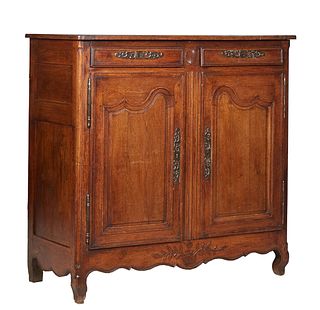 French Provincial Carved Oak Sideboard, 19th c., the ogee edge rounded corner top over two setback frieze drawers over double large fielded panel cupb