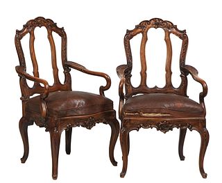 Pair of French Louis XV Style Carved Mahogany Fauteuils, early 20th c., the arched canted floral carved back with vertical splats, to curved arms, ove