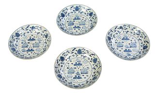 Set of Four Chinese Blue and White Porcelain Footed Bowls, 20th c., the interior with floral and bird decoration, the exterior with like floral decora