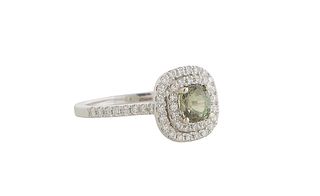Lady's 14K White Gold Dinner Ring with a cushion cut 1.02 ct. alexandrite atop two concentric graduated borders of tiny round diamonds,the shoulders o
