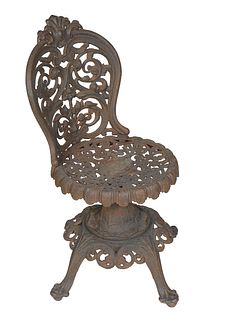 American Cast Iron Swivel Chair, 19th c., the curved canted foliate back over a pierced scrolled seat, on four splayed legs with paw feet, H.- 32 in.,