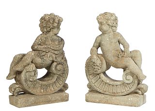 Pair of Cast Stone Allegorical Putti Garden Figures, 20th c., reclining on scrolled brackets, representing two of the four seasons, H.- 28 in., W.- 20