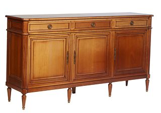 French Louis XVI Style Carved Cherry Sideboard, 20th c., the rectangular cookie corner top over three frieze drawers separated by reeded pilasters, ab
