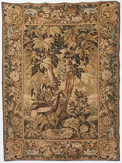 French Verdure Tapestry, 20th c., machine-made, of a peahen within a lush park setting, within a palmette and floral border.H- 48 in., W.- 66 in.