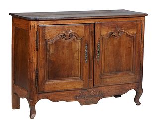 French Provincial Louis XV Style Carved Walnut and Oak Sideboard, 19th c., the ogee edge rounded corner two board top over double fielded panel cupboa