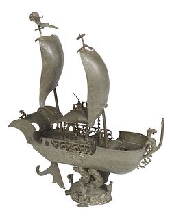 Unusual Pewter Model of a Dutch Ship, 19th c., with two sails unfurled, the deck with small sailor figures, on an integral wave form support, H.- 20 i