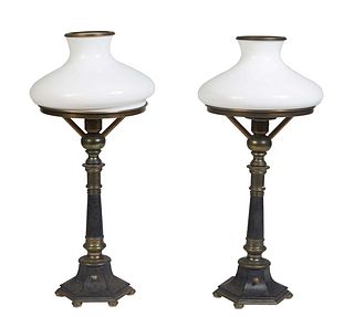 Pair of Iron and Brass Sinumbra Lamps, 20th c., the shade ring on a tapered cylindrical support on a tapered hexagonal plinth on six disc feet, with m