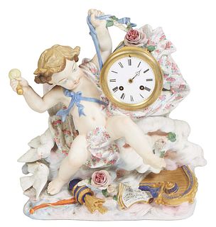 Achille Brocet and Jean Baptiste Deletrez, "French Figural Porcelain Clock," 19th c., with a large winged Cupid figure flanking a time and strike drum