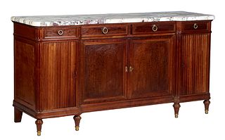 French Louis XVI Style Carved Walnut Marble Top Sideboard, 20th c. the thick highly figured gray and white breakfront marble, over two central setback