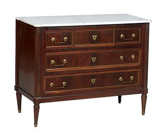 French Louis XVI Style Ormolu Mounted Carved Walnut Marble Top Commode, early 20th c., the ogee edge cookie corner figured white marble over a large d
