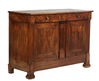 French Provincial Louis Philippe Carved Walnut Sideboard, 19th c., the rectangular top over three setback frieze drawers, above double cupboard doors 