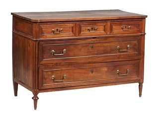 French Provincial Louis XVI Style Carved Walnut Commode, late 19th c., the rectangular cookie corner top over three frieze drawers and two deep drawer