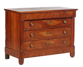 French Empire Style Carved Cherry Commode, 19th c. the rectangular top over a frieze drawer above three setback deep drawers, flanked by cylindrical e