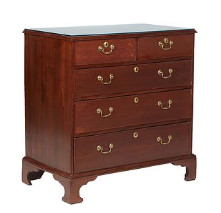 English Georgian Style Carved Mahogany Chest, 20th c., the stepped rectangular top over two frieze drawers above three deep drawers, on a plinth base 
