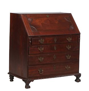 American Carved Mahogany Slant Front Desk, late 19th c., the rectangular top over a slant lid opening to an interior fitted with nine drawers and ten 