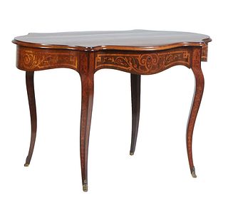 Italian Marquetry Inlaid Carved Mahogany Center Table, 19th c., the ogee edge stepped tortoise top, over an inlaid wide skirt with one frieze drawer, 