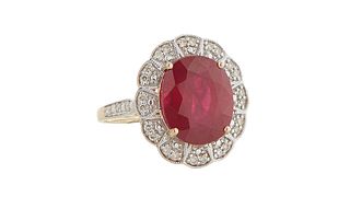 Lady's 14K White Gold Dinner Ring, with an oval 8.64 ct. ruby atop a scalloped relief border mounted with small round diamonds, total diamond wt.- .28