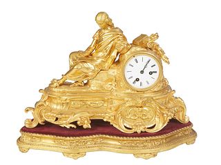 French Gilt Bronze Figural Mantel Clock, 19th c., surmounted with a figure of a woman reading, next to a time and strike drum clock by Japy Freres, th