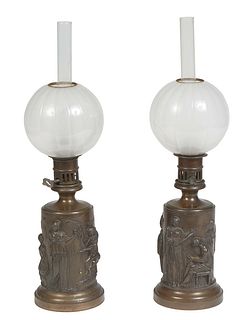 Pair of French Patinated Bronze Carcel Lamps, 19th c., with relief classical figural decoration on integral sloping stepped circular bases, with bronz