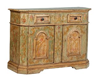 Italian Paint Decorated and Polychromed Sideboard, 19th c., the rounded edge canted corner top over two deep frieze drawers, above double scroll decor