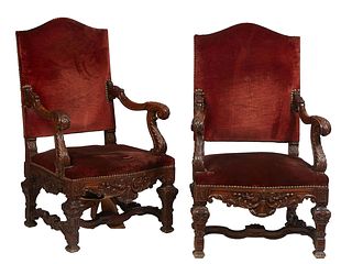 Pair of French Carved Walnut Fauteuils A La Reine, late 19th c., the arched canted cushioned back to well carved arched scrolled arms, over a bowed cu