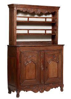 French Provincial Carved Oak Louis XV Style Vaisselier, 19th c., the stepped rounded corner ogee edge crown over a scalloped frieze above two spindled