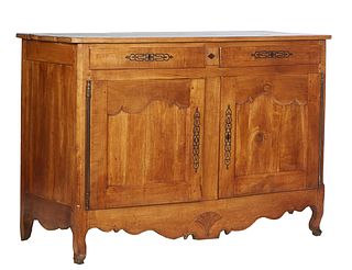French Provincial Carved Walnut Louis XV Style Sideboard, 19th c., the canted corner rectangular top over two frieze drawers with long iron escutcheon