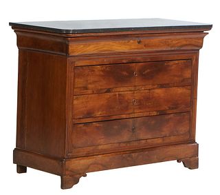 French Louis Philippe Carved Walnut Marble Top Commode, 19th c., the rounded corner reeded edge figured black marble over a cavetto frieze drawer and 
