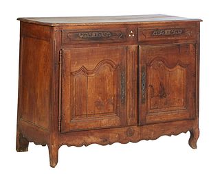 French Provincial Louis XV Style Carved Cherry Sideboard, 19th c., the stepped rounded edge and corner top over double fielded panel cupboard doors wi