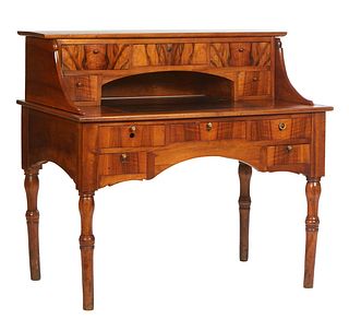 French Provincial Louis Philippe Carved Walnut Desk, 19th c., the setback rectangular curved superstructure top with five fitted drawers, atop a base 