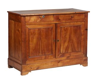 French Provincial Louis Philippe Carved Cherry Sideboard, 19th c., the rounded edge and corner top over two setback frieze drawers above double cupboa