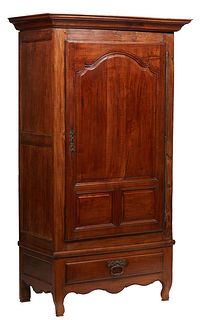 French Provincial Louis XV Style Carved Walnut Bonnetiere, 19th c., the stepped ogee crown over a large fielded panel door with a long iron fiche hing