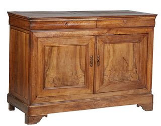 French Provincial Louis Philippe Carved Walnut Sideboard, 19th c., the ogee edge rounded corner top over two cavetto frieze drawers above double cupbo