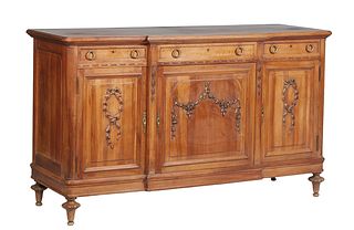 French Provincial Louis XVI Style Carved Walnut Sideboard, early 20th c., the rounded edge and corner breakfront top over a setback center frieze draw