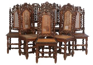 Near Set of Ten French Carved Louis XIII Style Dining Chairs, late 19th c., consisting of seven with lion carved crests over arched caned vertical spl